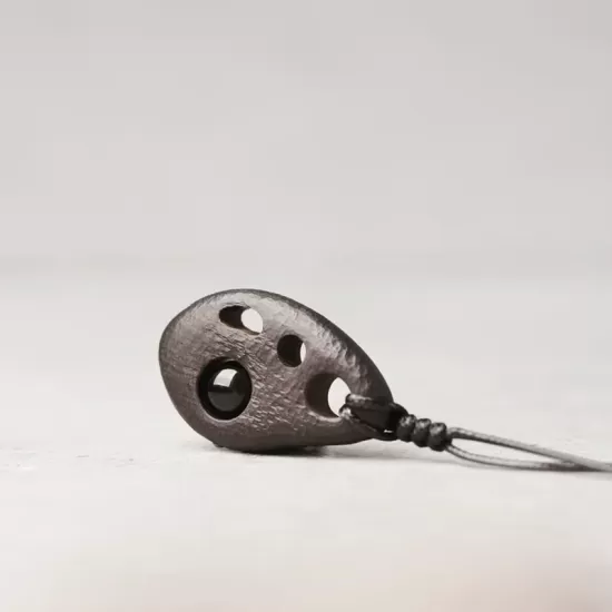 Perforated Ebony Wood & Obsidian Pendant Necklace Perforated Ebony Wood & Obsidian Pendant Necklace