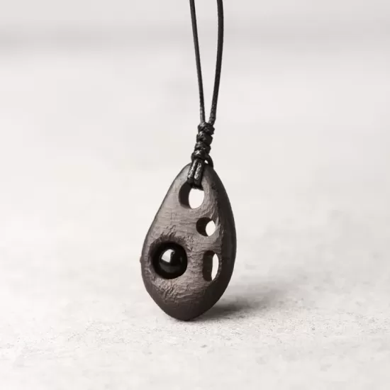 Perforated Ebony Wood & Obsidian Pendant Necklace Perforated Ebony Wood & Obsidian Pendant Necklace