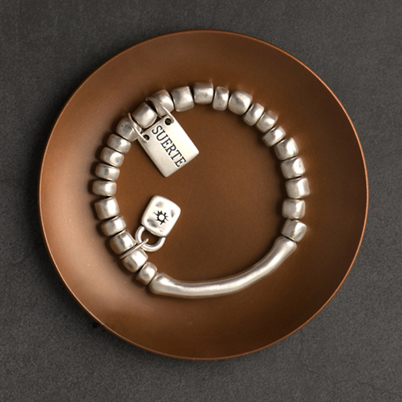 Silver bracelet photographed to show where fineness and maker marks may need verification